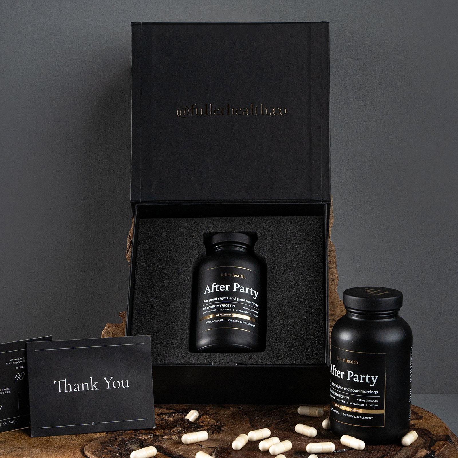 Custom magnetic closure box with bottle-shaped foam insert holding the product