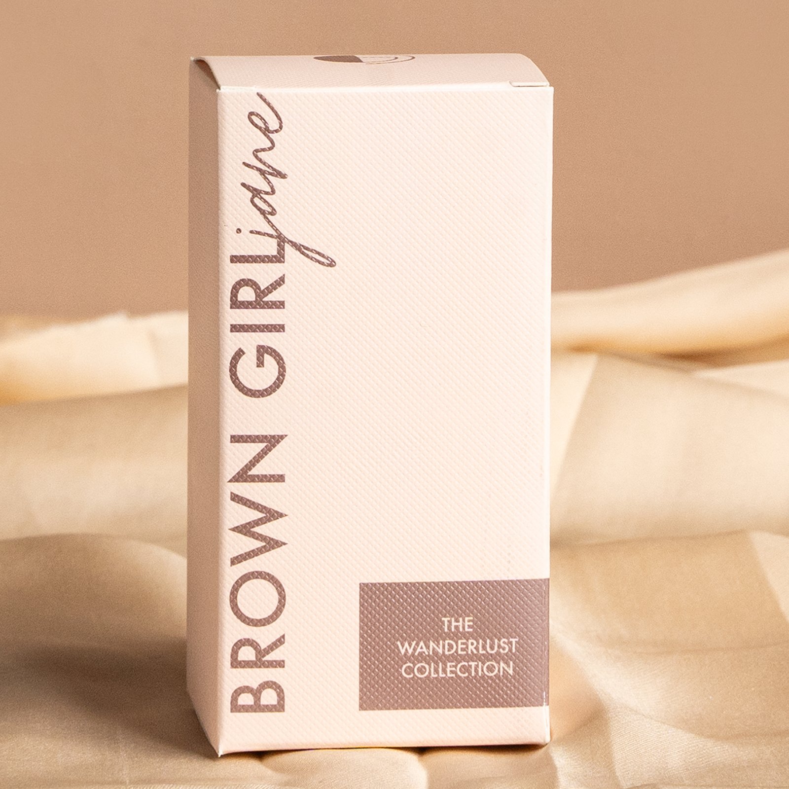 custom packaging tuck box in a greenish color featuring our client’s branding in hot gold foil stamping with printed patterns