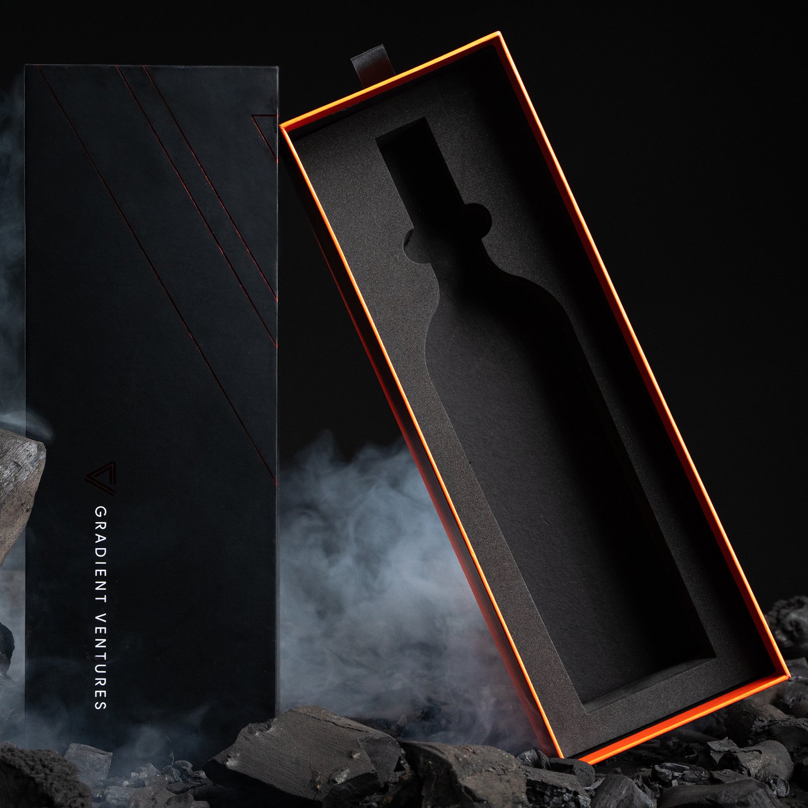 Custom wine packaging box in two-piece style with a custom die-cut bottle-shaped foam insert